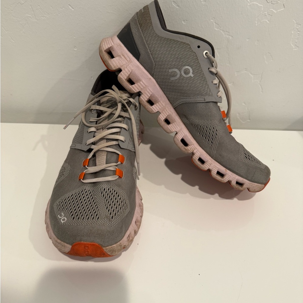 On Running Gray Shoes with Orange Highlights
